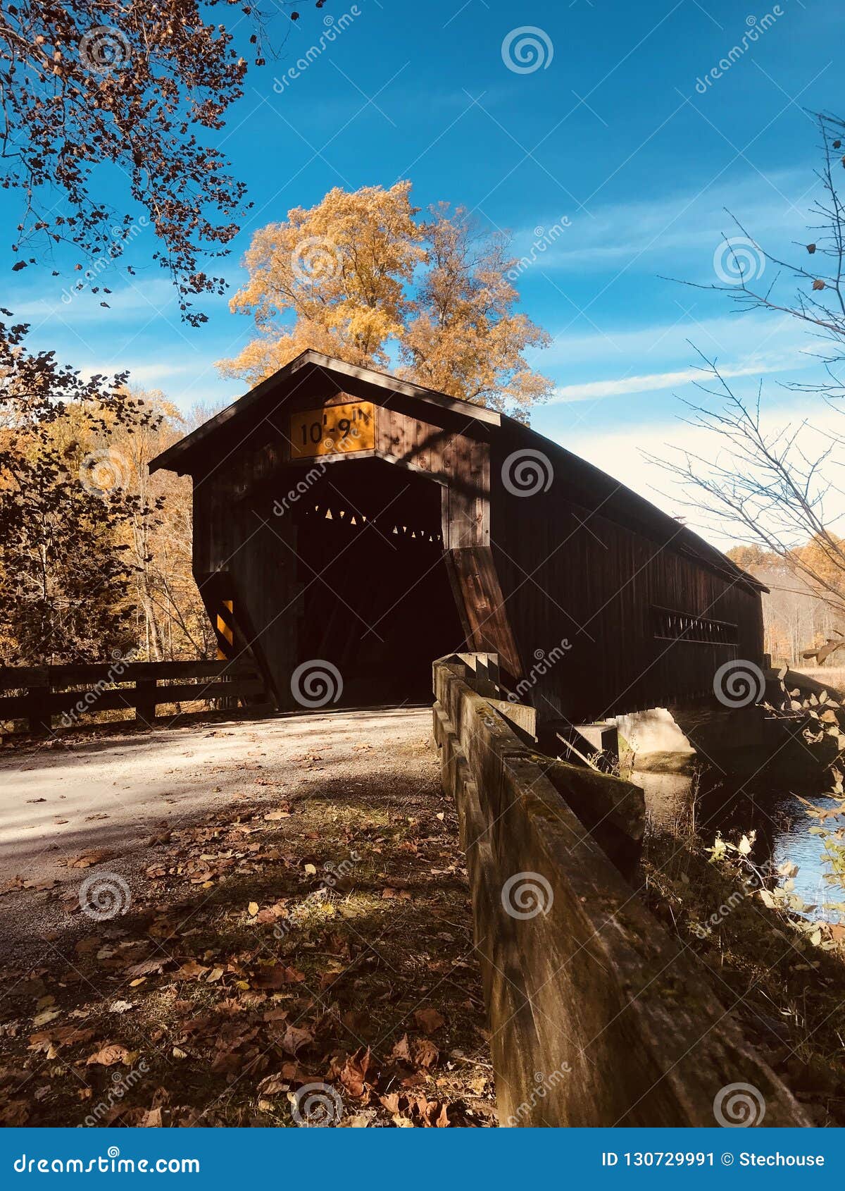 autumnal view of the benetka covered bridge - ashtabula - ohio